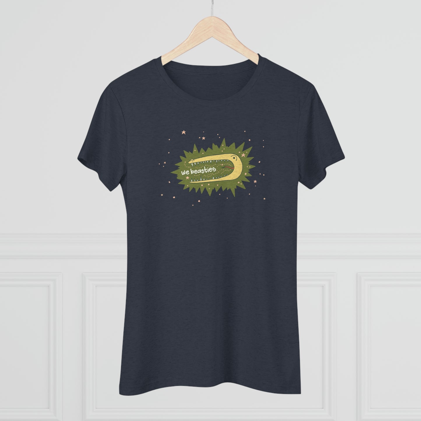 A varigated dark blue t-shirt with the We Beasties logo (a yellow alligator on a green star burst surround by pink stars and the words "We Beasties" in the alligator's mouth.) The shirt is shown on a wood hanger.