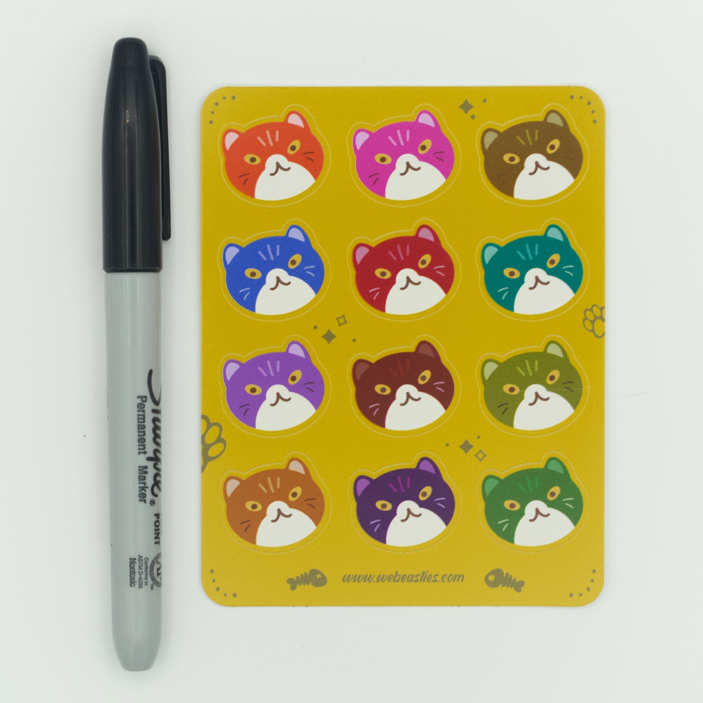 A single sticker sheet shown next to a Sharpie marker for scale.