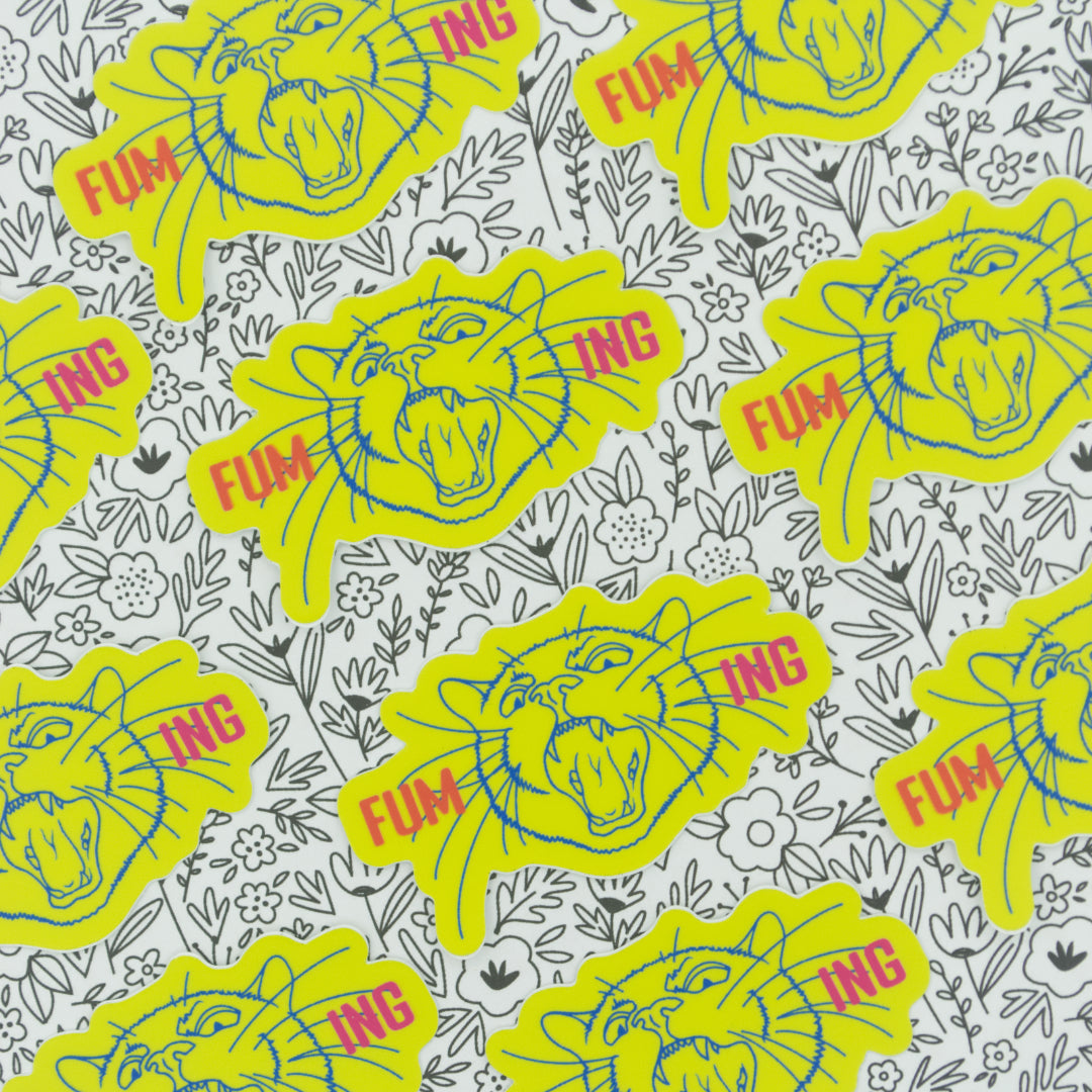 Neon yellow stickers with the word fuming broken into two on either side of a screaming cat head tiled across a black and white background.